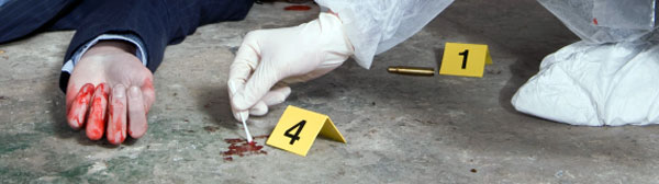 A crime scene investigator swabbing a spot on the floor of a crime scen near a body