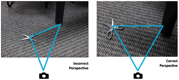 2 photographs of a pair of scissors on the floor and a table leg. Photo 1 shows an angle ov view. Photo 2 shows no angle of view.